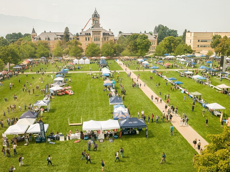 The USU Quad is filled with booths and people during a smoggy day