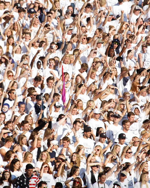 USU Students in white at the football game.