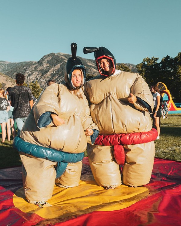 Two USU students wear sumo wrestler costumes