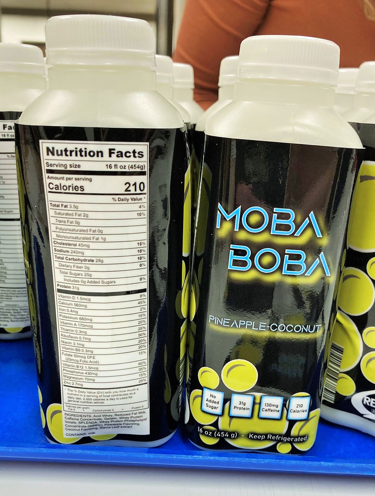 Bottles of MOBA Boba dairy energy drink for gamers.